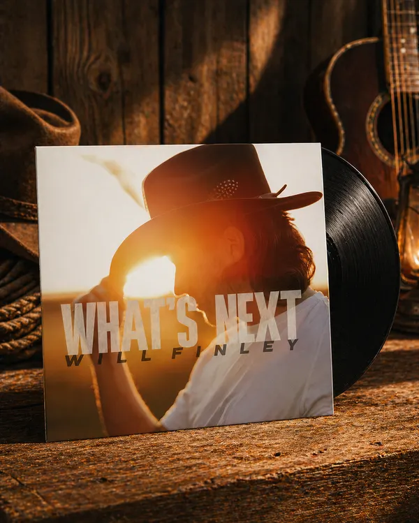 Signed Will Finley What's Next vinyl with the record half-pulled from the jacket